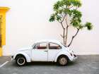 Pastel Volskwagen Beetle in the streets of Oaxaca Mexico Art Print