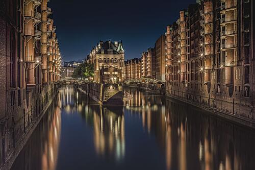 Illuminated Canal City Night Art Print by Michael Essig