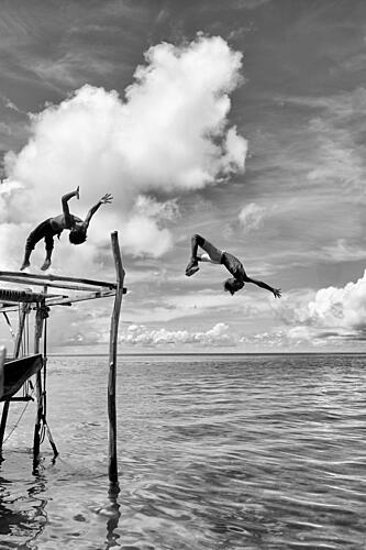 Kids Leaping into Ocean Art Print