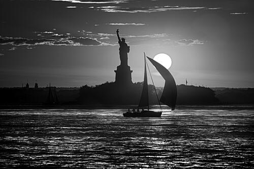 Lady Liberty Sunset Sail Art Print by Michael Castellano