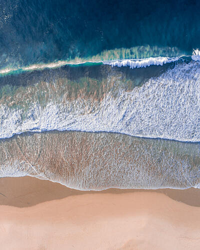 Turquoise Waves Sandy Beach Art Print by Ryan Warneke