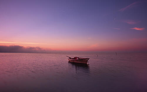 Solitary Boat Twilight Art Print by Juan Carlos Hervas Martinez
