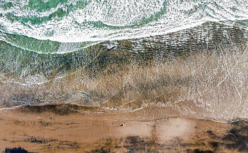 Ocean Waves on Sand Art Print by Martin Blahak
