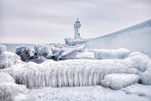Icy Coastal Lighthouse Art Print by Dieter Weck