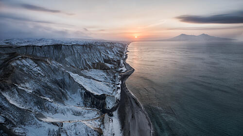 Snowy Coastal Sunset Art Print by Ivan a. Godovikov