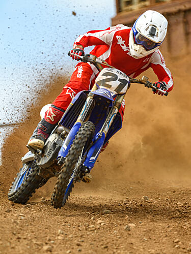 Motocross Rider Kicking Dust Art Print by Rayco