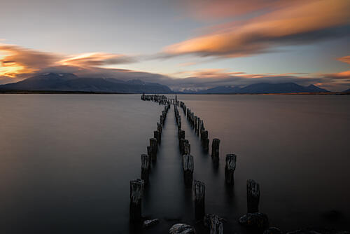 Tranquil Pier Sunset Art Print by Tom Lang