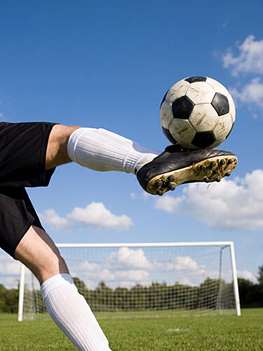 Kicking a Soccer Ball Art Print
