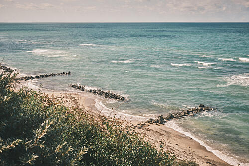 Ocean Beach Breakwaters Art Print by Luca Stefanelli