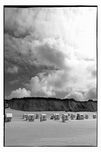 Beach Chairs under Clouds Art Print