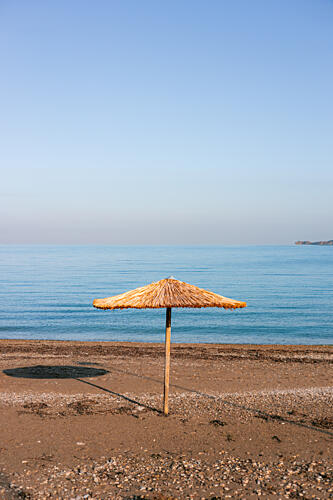 Straw Umbrella Beach View Art Print by HelloHappylife