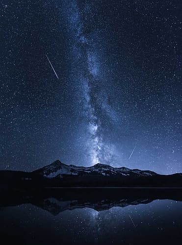 Galaxies Reflection Art Print by Toby Harriman