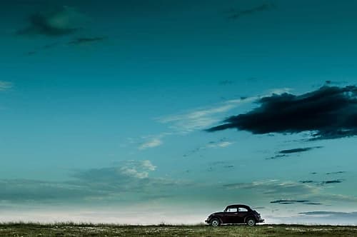 The Red Vw Beetle Art Print by Camilo Otero