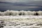 Sea with wave backwash in a cloudy day Art Print