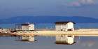 White cabins between the sea and the salina Art Print