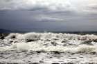 Waves ebb in a cloudy day Art Print