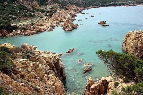 Rocky cliffs on turquoise sea in Sardinia Island Art Print