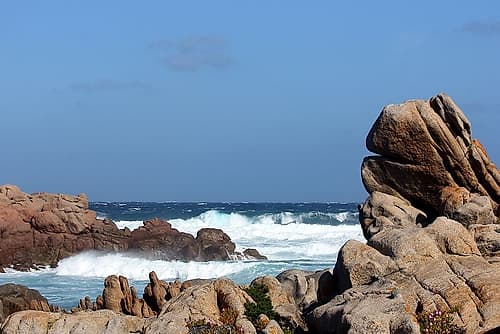 Jagged rocks and blue sea in sardinia Island Art Print