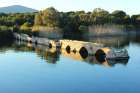 Ancient Roman bridge on the pond Art Print