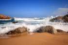 White Sea Foam on red rocks beach Art Print