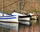 Three berthed boats Art Print