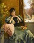 Pensive woman near a window Art Print