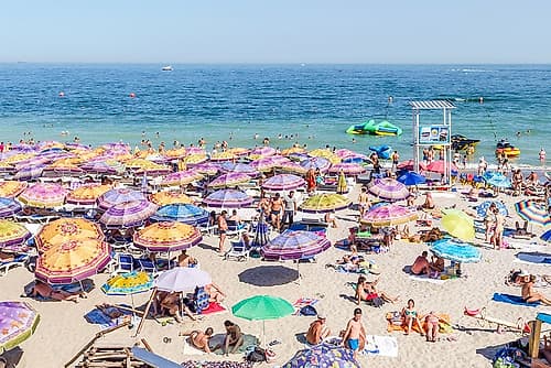 Beach with Floral Pattern Umbrellas Art Print