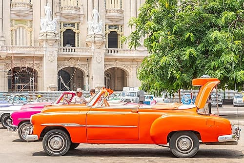 Orange Convertible Havana Theater District Art Print