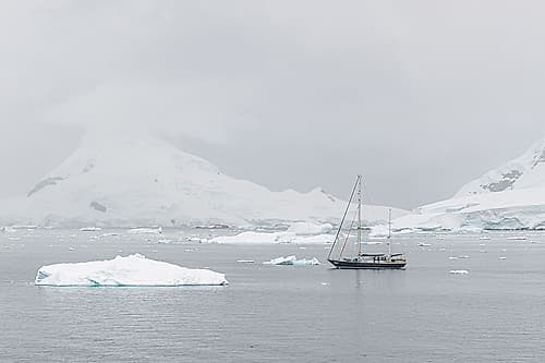Sailboat Among Antarctic Icebergs II Art Print
