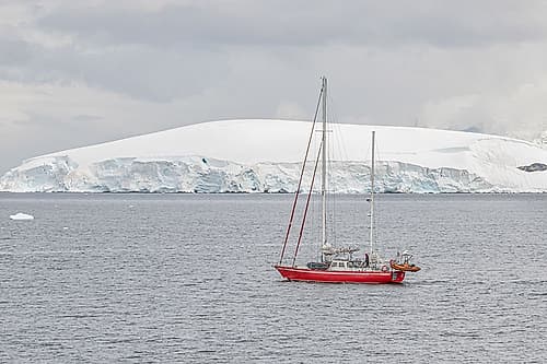 Red Sailboat and Tabular Iceberg Art Print