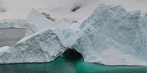 Iceberg with Dark Cave Opening Art Print