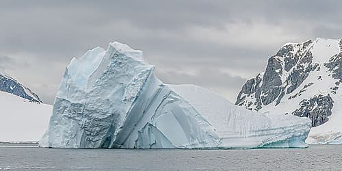 Pyramid Iceberg with Mountains Art Print