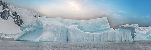 Panoramic Iceberg Glowing Sun Art Print