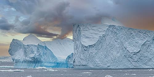 Iceberg Under Sunset Storm Sky Art Print