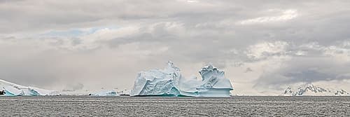 Panoramic Iceberg with Distant Peaks Art Print