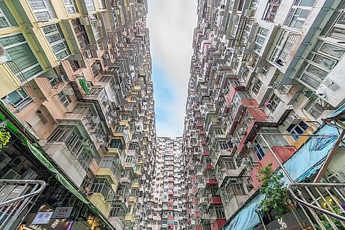 Hong Kong Narrow Gap Between Apartment Blocks Art Print by Richard Silver