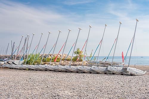 French Riviera Sailboats on Pebble Beach Plage reproduction