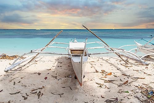 Bangka Boat on Sandy Beach at Sunset, Philippines Art Print by Richard Silver