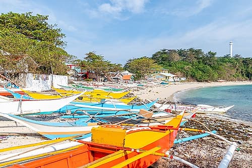 Colorful Fishing Boats with Distant Lighthouse, Philippines Art Print