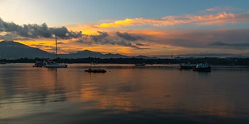 Harbor at Dusk with Mountain Backdrop, Philippines Art Print