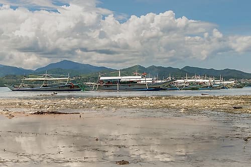 Fishing Boats at Low Tide with Mountains, Philippines Art Print