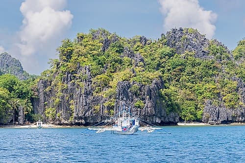 Bangka Boat Passing Limestone Cliffs, El Nido, Palawan, Philippines Art Print