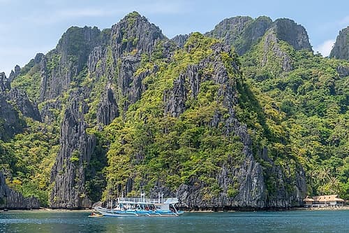Boat Beneath Towering Karst Cliffs, El Nido, Palawan, Philippines Art Print