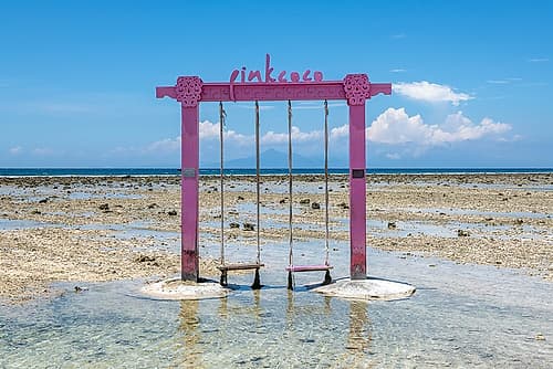 Pink Beach Swing in Shallow Water, Gili Islands, Indonesia Art Print