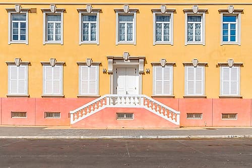 Colorful Colonial Building with Curved Staircase Art Print by Richard Silver