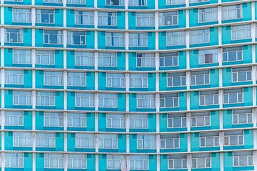 Teal Apartment Building Facade with Balconies Geometric Print