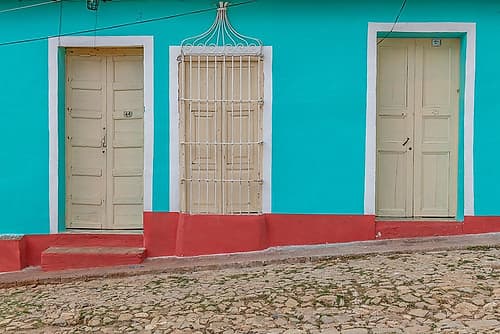 Turquoise Facade on Cobblestone Street, Trinidad, Cuba Art Print