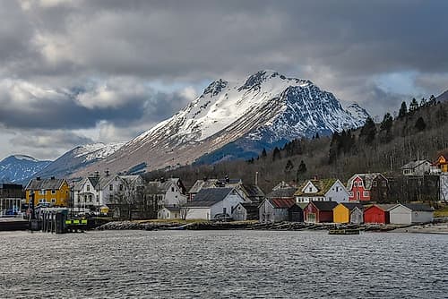 Fjord Village with Snow-Capped Mountain, Norway Art Print
