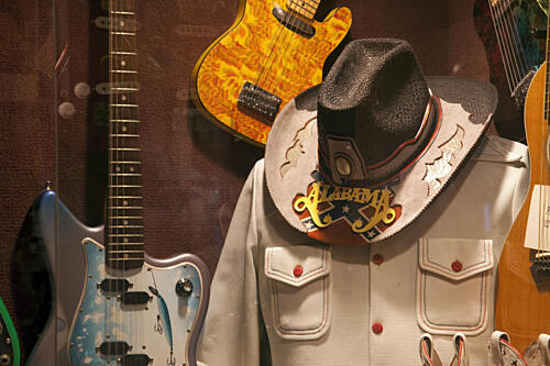 Display of Guitars and Clothing Related to Alabama the Rock Band in Fort Payne, Alabama I Fashion Print