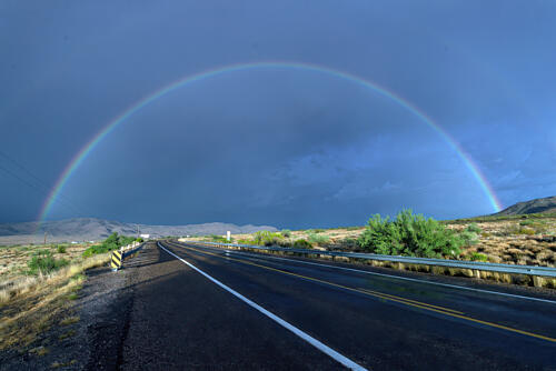A Natural Rainbow Arch Surmounts the Highway Outside Seligman, Arizona Art Print